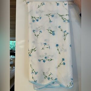 Blue and White Floral Carlin decorative coverlet to go on top of bedding.